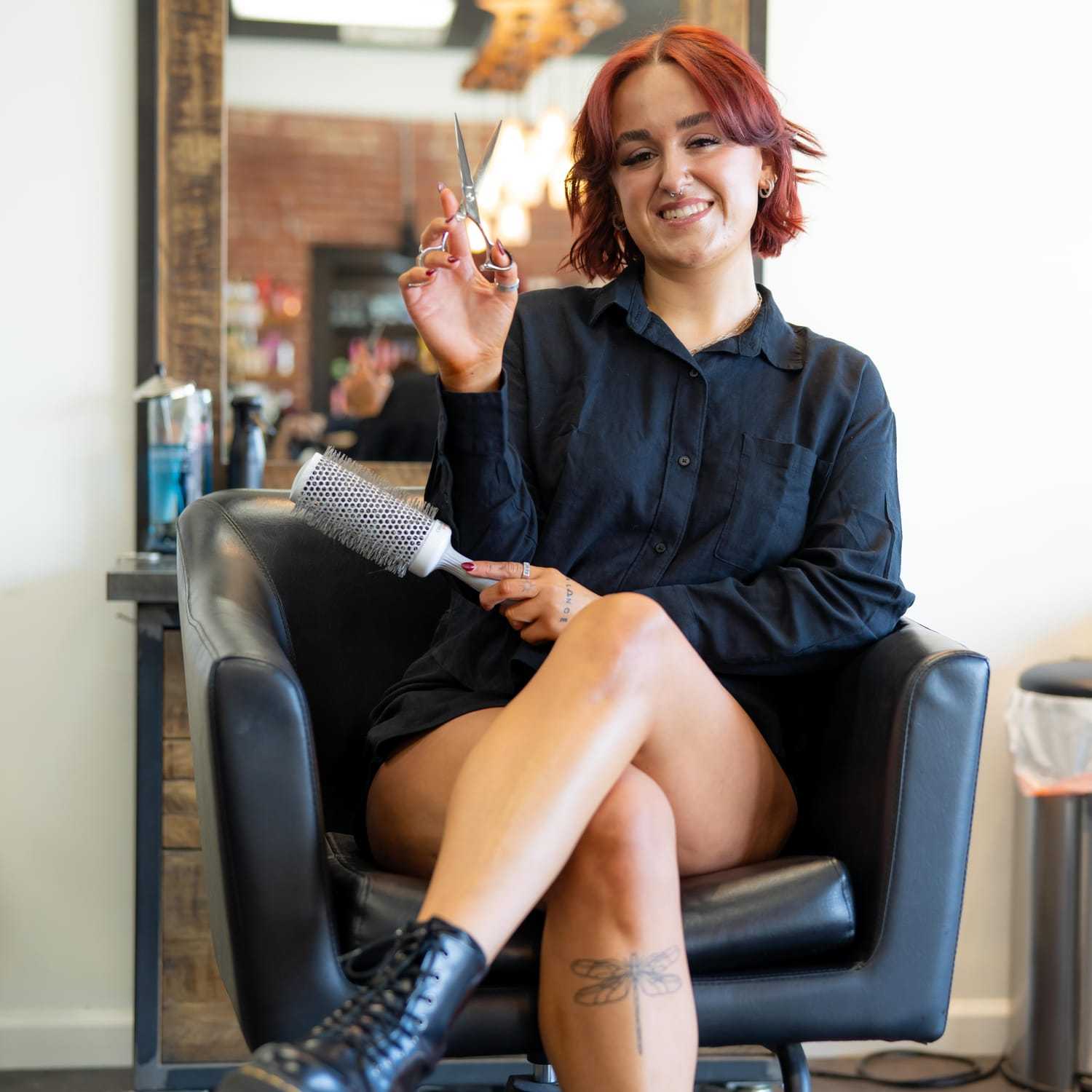 Portrait of Haley, a professional stylist at Elevate Hair Studio by Tricia Cosgrove, showcasing their expertise and style.